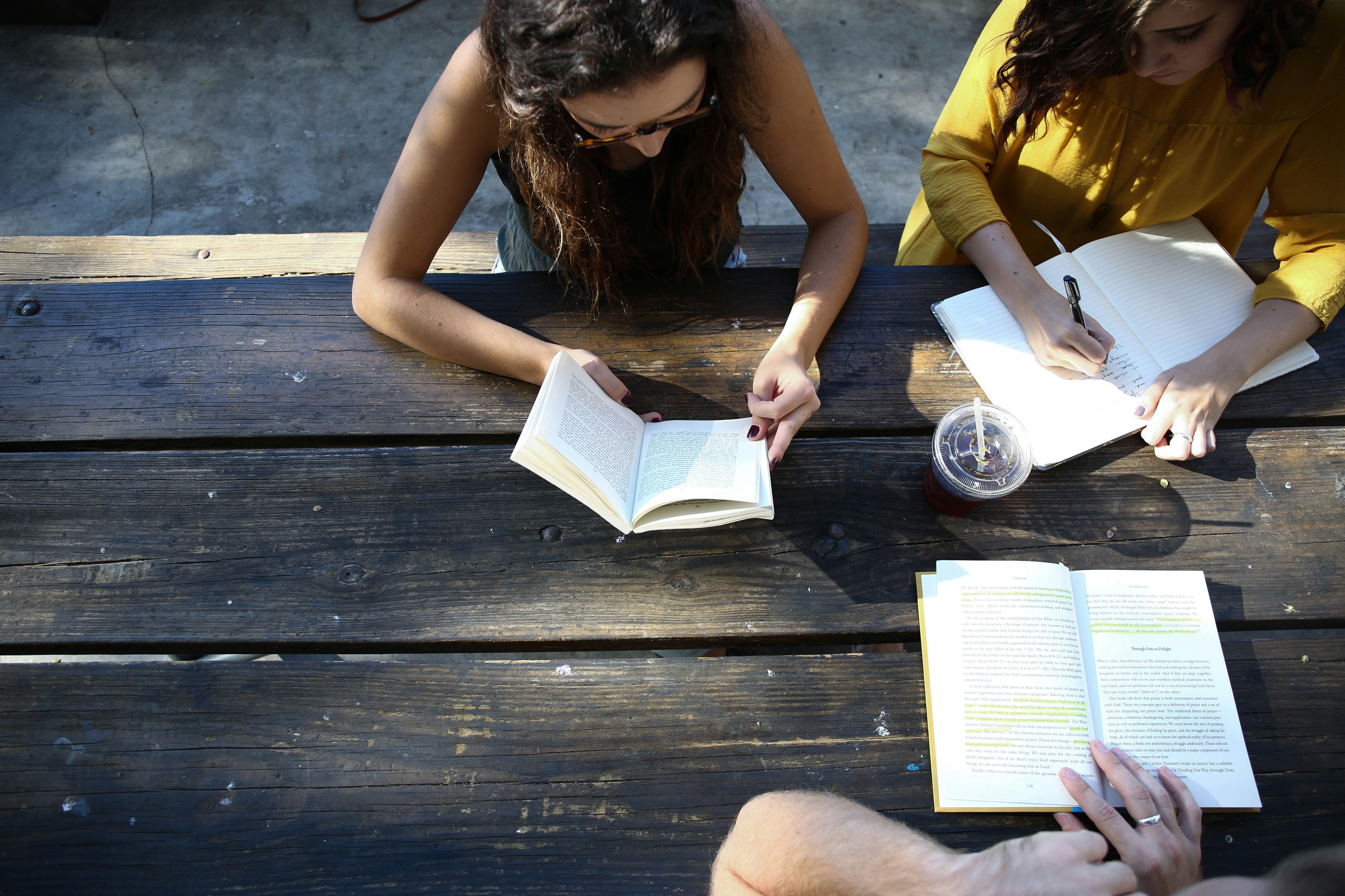 group of people reading books